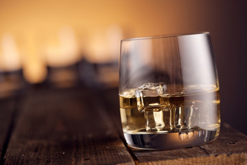 Whiskey in glasses on wooden table