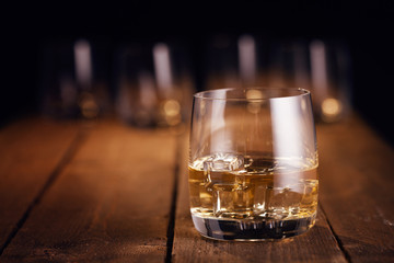 Whiskey drink on wooden table