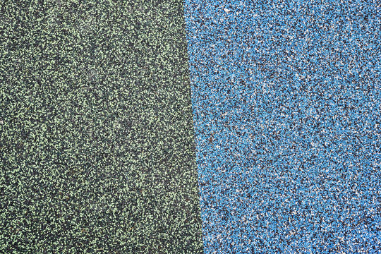 Texture. Childrens playground floor.Rubber and stones.