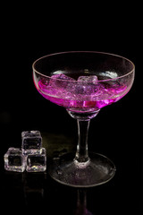 Cocktail of bright colors on a black background.