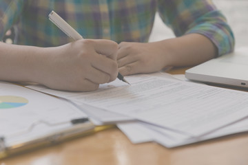 woman hand, pen, business document, laptop computer notebook