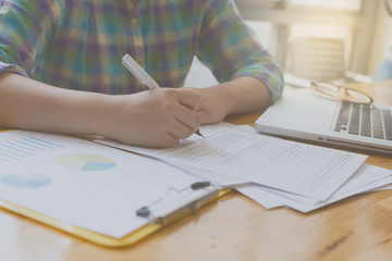 woman hand, pen, glasses, business document, laptop computer not