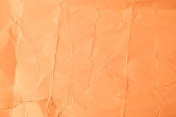Texture creased orange paper background.