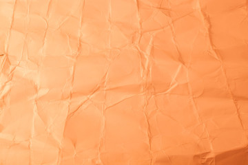 Texture creased orange paper background.