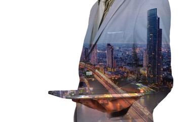 Double Exposure image of Businessman use Digital Tablet and City