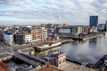 Obraz premium ANTWERP, BELGIUM - JAN 4: Aerial view of Antwerp port area with marina harbor form roof terrace museum MAS on January 4, 2015 in the harbor of Antwerp, Belgium
