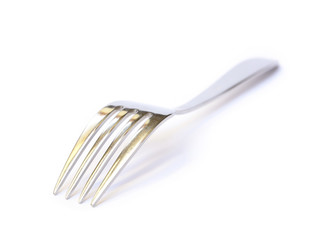 Shiny metal fork on a white background