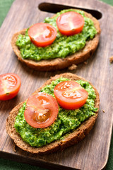 Bruschetta with pesto sauce and tomatoes