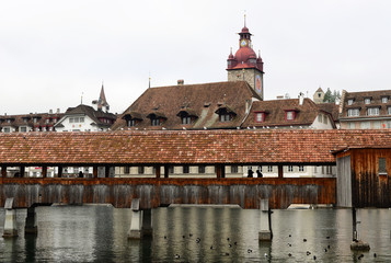 the famous Chapel Bridge and Clock tower background in early winter