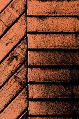 Red narrow horizontal and diagonal stylized bricks background vertical composition