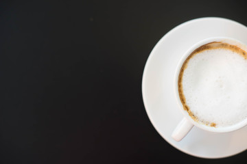 Cappucino coffee on black background