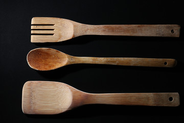 wooden spoon on black background,from above