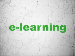 Learning concept: E-learning on wall background