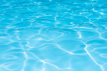 Naklejka na ściany i meble Beautiful water surface in swimming pool with sun reflection