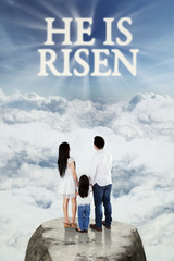 Family looking at text he is risen