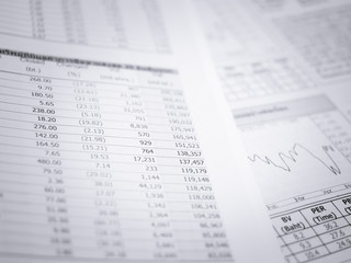 Fototapeta premium Business document over paper with chart in blue light.