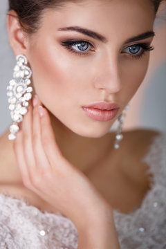 gorgeous bride with crown jewelry , girl in wedding dress fashion model
