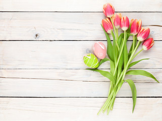 Colorful tulip bouquet and easter eggs