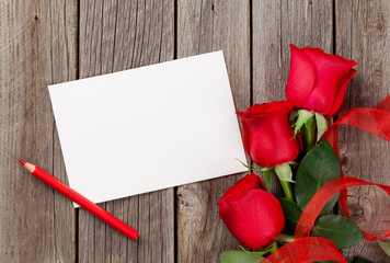 Red roses and greeting card