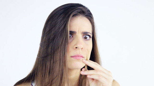 Beautiful woman cutting split ends hair with scissors closeup