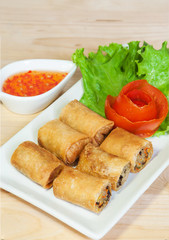 Fried Chinese Traditional Spring rolls food isolated on wood bac