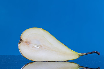 Slice Pear on a Blue Background