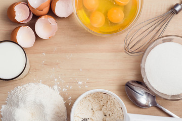 Ingredients pancakes on a wooden background