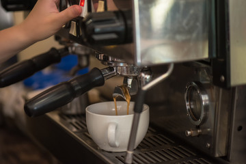 preparing coffee in cafe