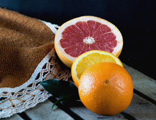 Slice of grapefruit and orange on the table