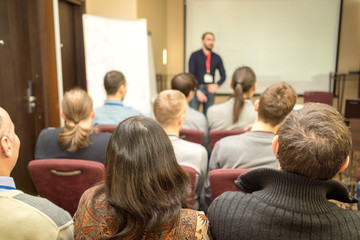 Speaker Giving a Talk at Business Meeting. Audience in the conference hall. Business and Entrepreneurship.