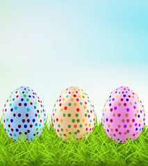 Festive Easter eggs on the grass