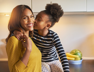 Black mom and daughter loving each other