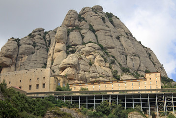 MONTSERRAT, SPAIN - AUGUST 28, 2012: Benedictine abbey Santa Maria de Montserrat in Monistrol de Montserrat, Spain