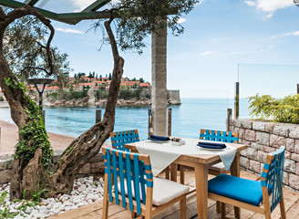 Tables at seaside restaurant 