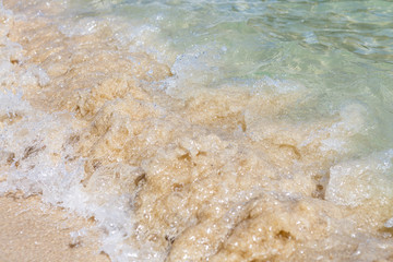 Fototapeta na wymiar wave of the sea on sand beach
