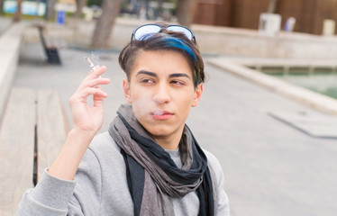 teen boy smokes