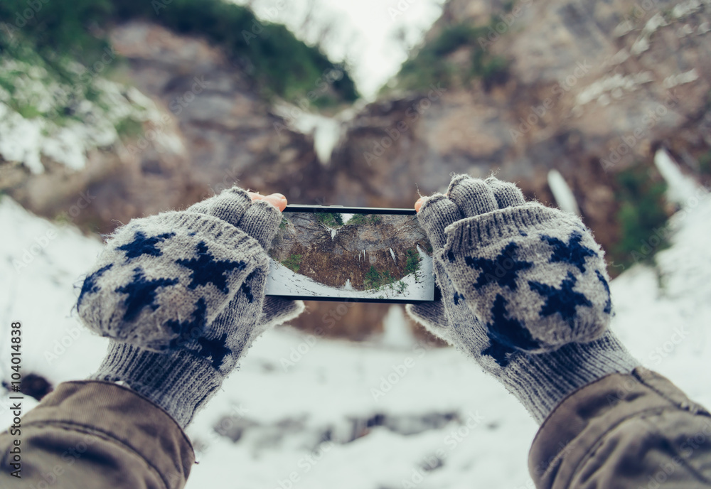 Wall mural taking photographs the winter landscape