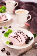 Mousse cakes covered with pink glaze 