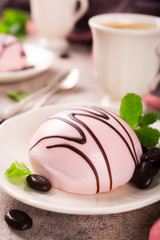 Mousse cakes covered with pink glaze 