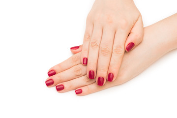 Woman hands with red nail isolated on white