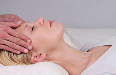Obraz na płótnie Canvas Woman enjoying head massage. Chiropractic, Osteopathy concept.