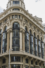 Fototapeta premium characteristic buildings on the street Gran Via in Madrid, capit