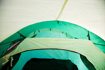 Green tent inside view – fastening roof