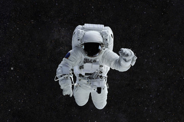 Spaceman travels on a background of stars. Astronaut outer space