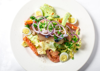 Salad with mackerel fish, zucchini, lettuce, carrots and creamy dressing 