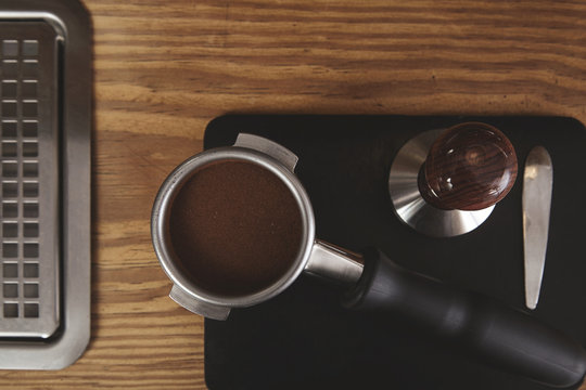top view portafilter coffee tamper wooden table