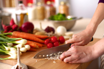 Young Woman Cooking in the kitchen. Healthy Food