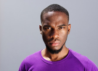 Young african man with serious expression on face