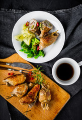 Pork rolls with cucumber and onion on plate