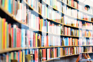 Bookshelf in public library, street reflection